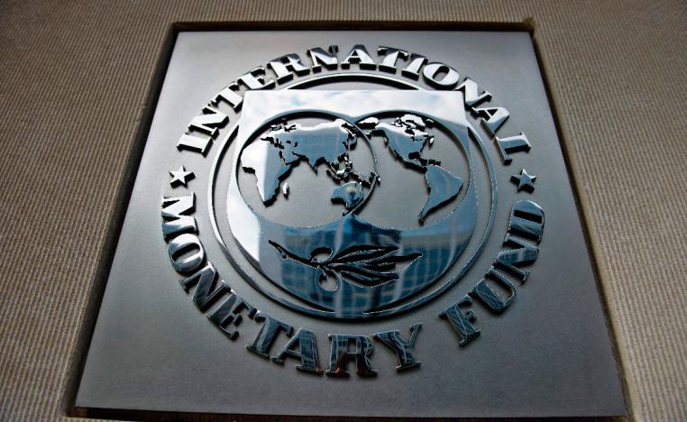 A logo is seen outside the headquarters of the International Monetary Fund in Washington