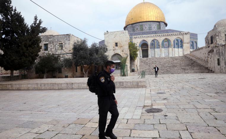 Israeli policeman walks in front of the Dome of the Rock in occupied East Jerusalem