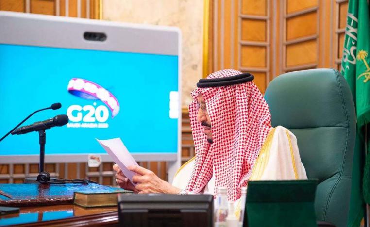 Saudi King Salman bin Abdulaziz speaks via video link during a virtual G20 summit on coronavirus disease