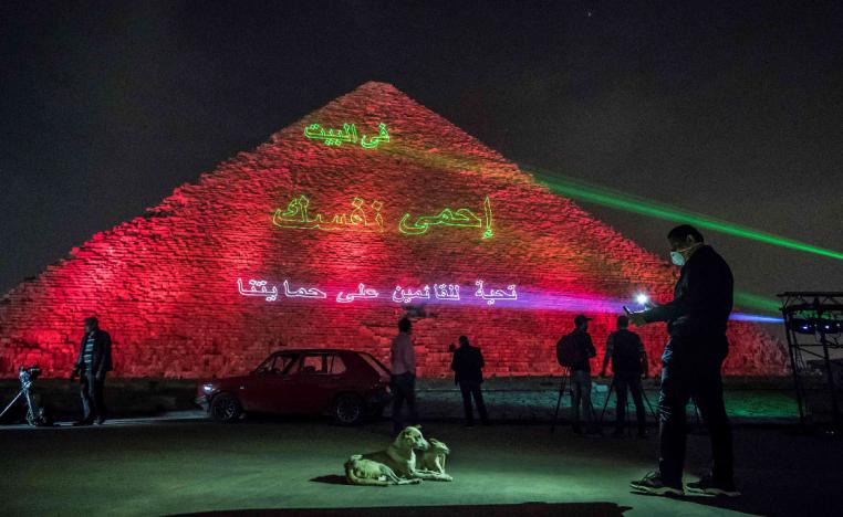 Laser projection on the Great Pyramid writes "Stay at home, stay safe."