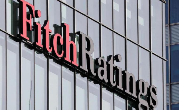 The Fitch Ratings logo is seen at their offices at Canary Wharf financial district in London