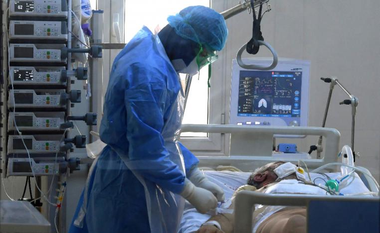 A Tunisian doctor attends to a Covid-19 patient