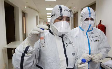 Doctor Meryem Bouchbika holds a sample tube in the Intensive Care Unit (ICU) at Prince Moulay Abdellah hospital 
