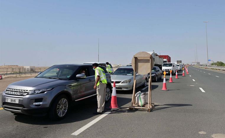 Emirati security forces man a checkpoint at the entrance of Abu Dhabi