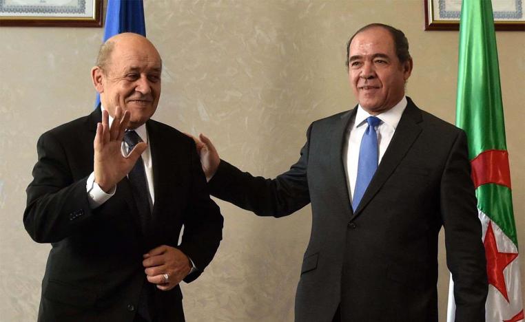 French Foreign Minister Jean-Yves Le Drian (L) and Algerian Foreign Minister Sabri Boukadoum