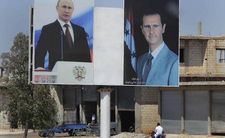 صورتان للرئيسين السوري بشار الأسد والروسي فلاديمير بوتين في بلدة الرستان