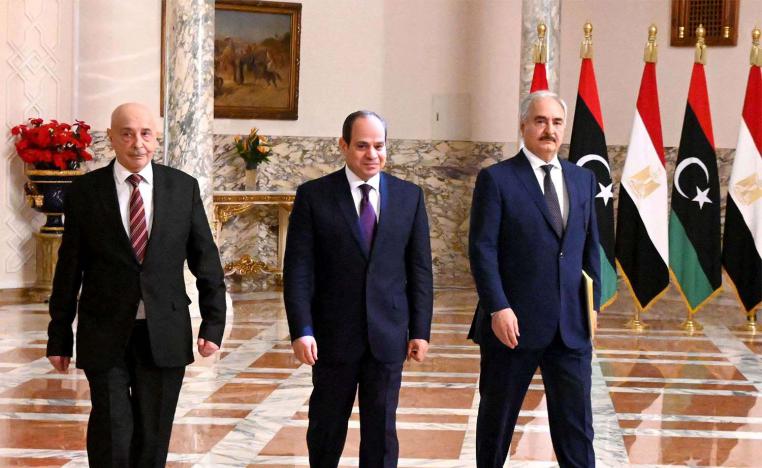 Egyptian President Abdel Fattah al-Sisi (C) and Libyan commander Khalifa Haftar (R)