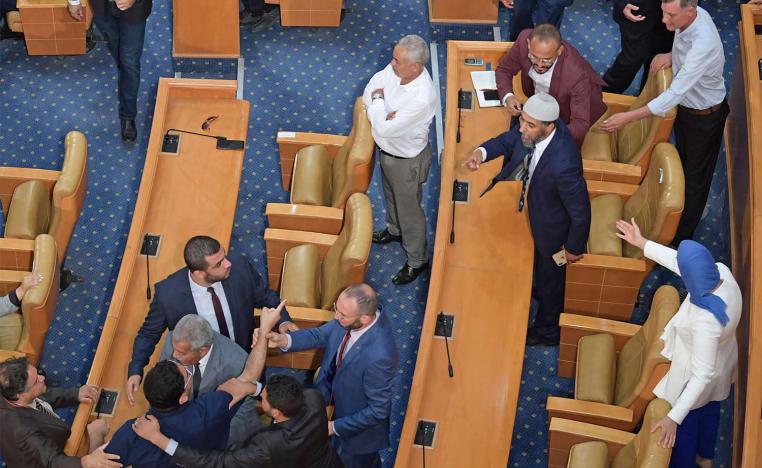 Tunisian MPs argue during a plenary session devoted to discussing a motion tabled by the Free Destourian Party