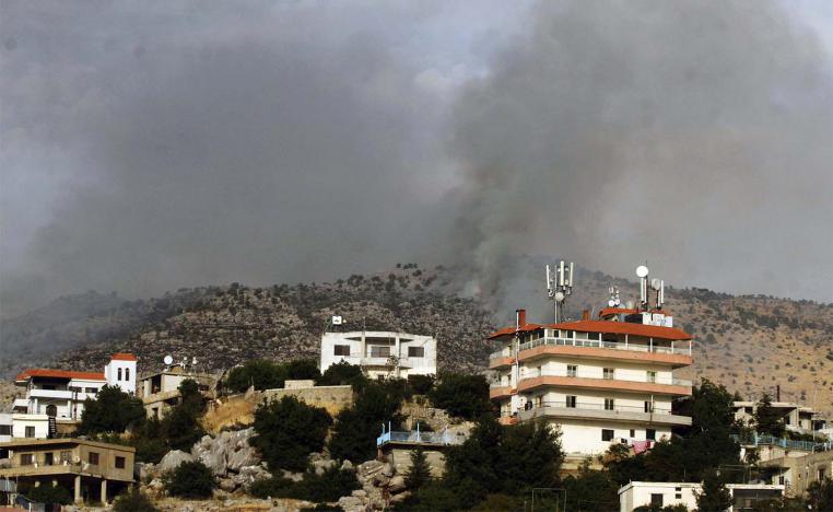 Smoke billows above the edges of southern Lebanon's Kfarchouba village after reported Israeli bombardment of the Shebaa Farms 