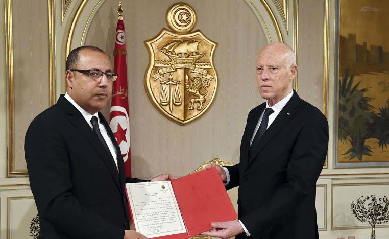Tunisian president Kais Saied (R) appoints Interior Minister Hichem Mechichi as the country's new prime minister
