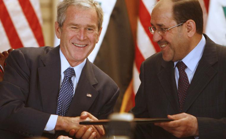 الرئيس الأميركي السابق جورج بوش مع رئيس الوزراء العراقي السابق نوري المالكي