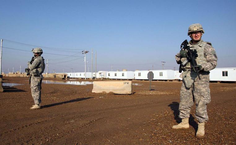 US soldiers walk around at the Taji base complex 