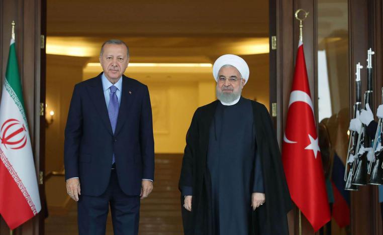 الرئيس التركي رجب طيب اردوغان ونظيره الايراني حسن روحاني