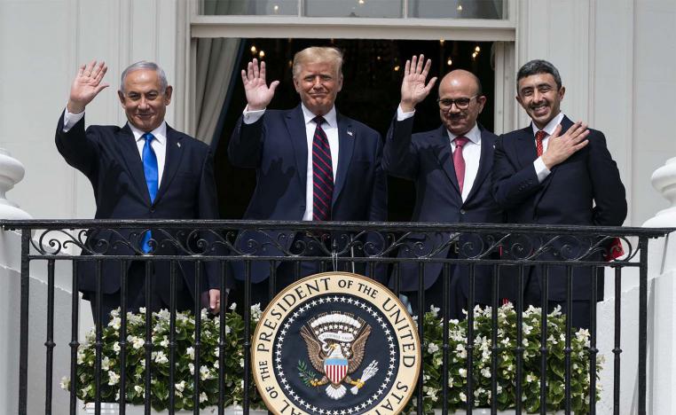 Israeli Prime Minister Benjamin Netanyahu, left, President Donald Trump, Bahrain Foreign Minister Khalid bin Ahmed Al Khalifa and United Arab Emirates Foreign Minister Abdullah bin Zayed al-Nahyan react on the Blue Room Balcony after signing the Abraham Accords 