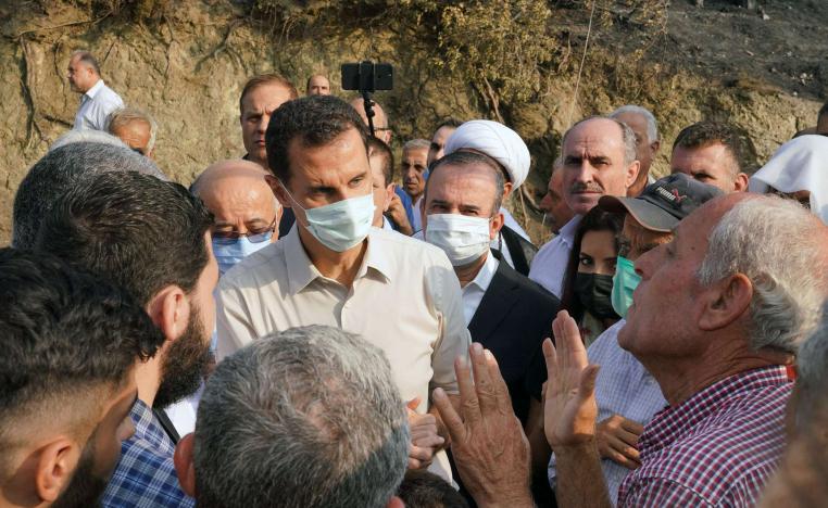 الأسد يتحدث مع متضررين من الحرائق الأخيرة 