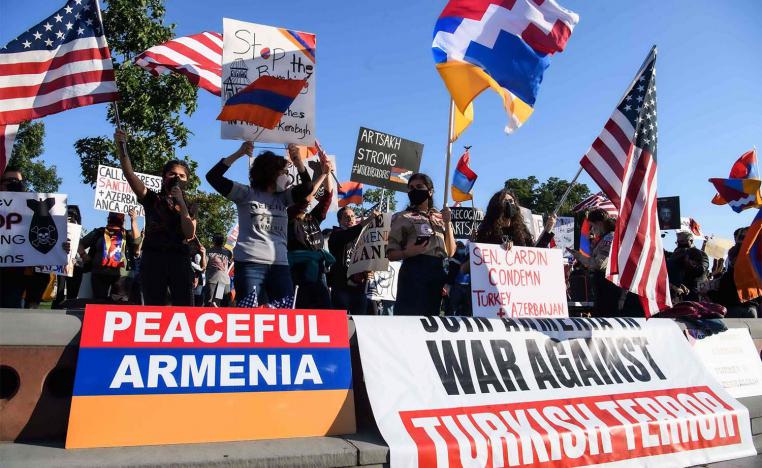Armenian-Americans hold signs and flags as they protest against Turkey's support for Azerbaijan in front of the US Capitol in Washington