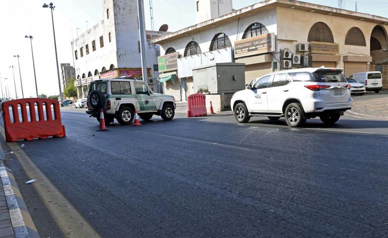 Saudi police close a street leading to a non-Muslim cemetery in the Saudi city of Jeddah