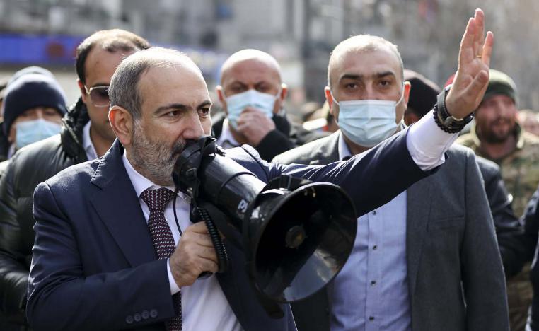 Armenian Prime Minister Nikol Pashinyan gestures speaking to a crowd in the center of Yerevan