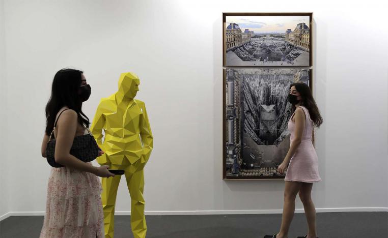 People visit Perrotin gallery of the 14th edition of Art Dubai at Dubai International Financial Centre