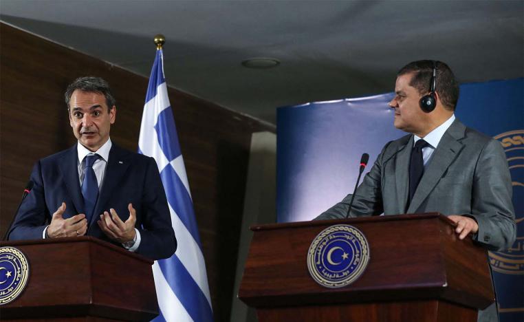 Libya's interim prime minister Abdul Hamid Dbeibah (R) and Greece's Prime Minister Kyriakos Mitsotakis (L)