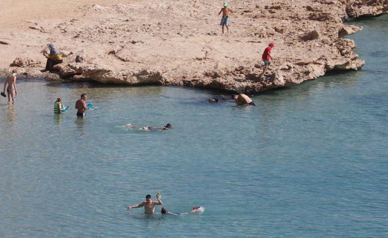 Tourists enjoy a day by the beach in the Red Sea resort of Sharm el-Sheikh.