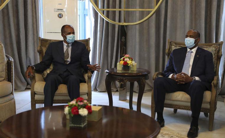 President of the Sudanese Transitional Council General Abdel Fattah al-Burhan, right, and Eritrean President Isaias Afwerki