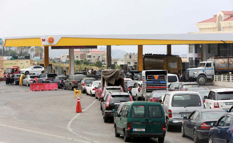 Cars stand in line at a gasoline station in Jiyeh, Lebanon