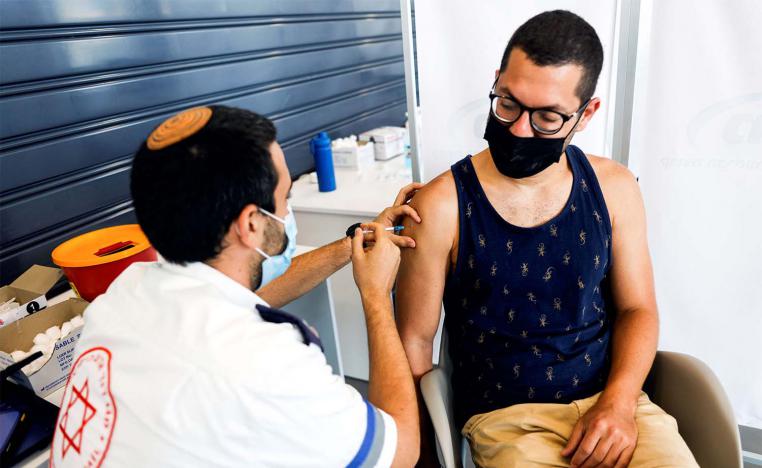 Israel is offering third booster shots to its entire eligible population