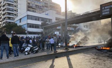 Roads were blocked by burning tyres in central Beirut, Tripoli and Sidon
