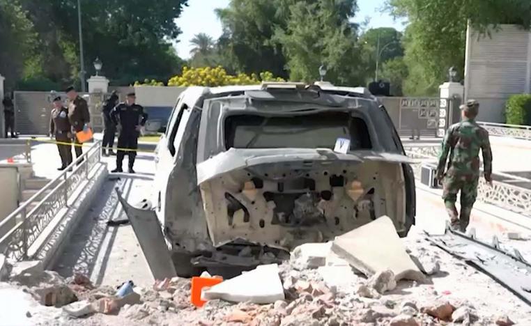 A damaged vehicle in the aftermath of a drone strike on Iraqi prime minister's residence