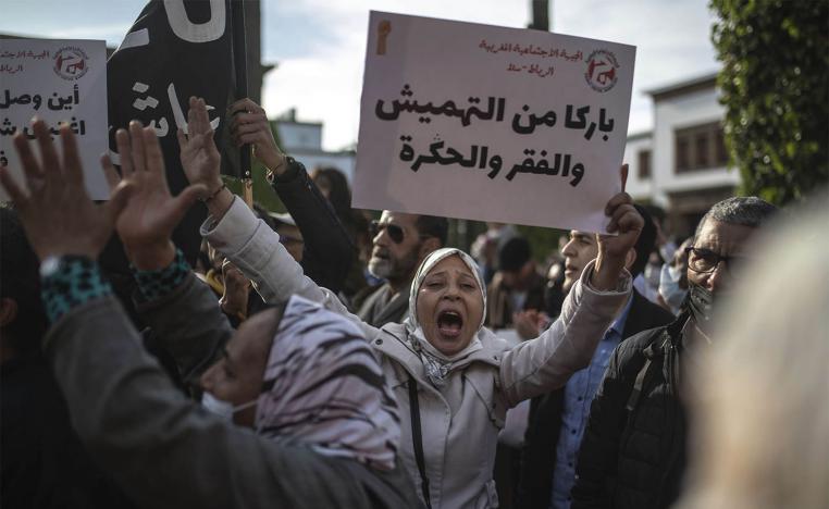 "Enough neglect, poverty and humiliation," reads the banner