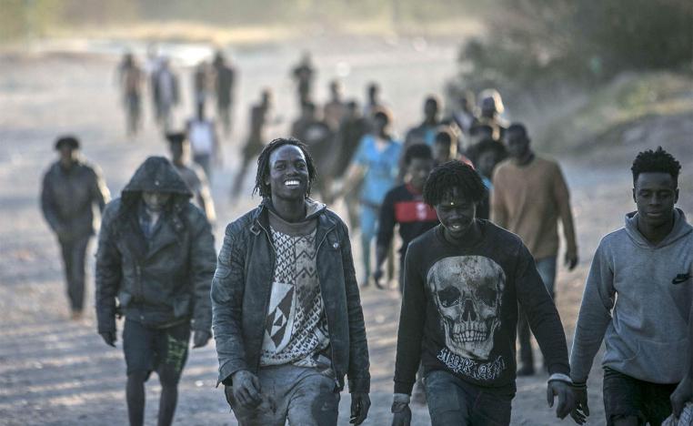 Migrants arrive on Spanish soil after crossing the fences