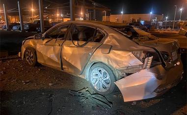 A car damaged by Houthi's drone attack at an Aramco oil terminal in the southern Saudi border town of Jizan o