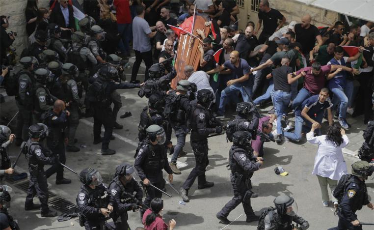 Israeli police beat mourners as they carried the casket of slain Shireen Abu Akleh during her funeral in east Jerusalem