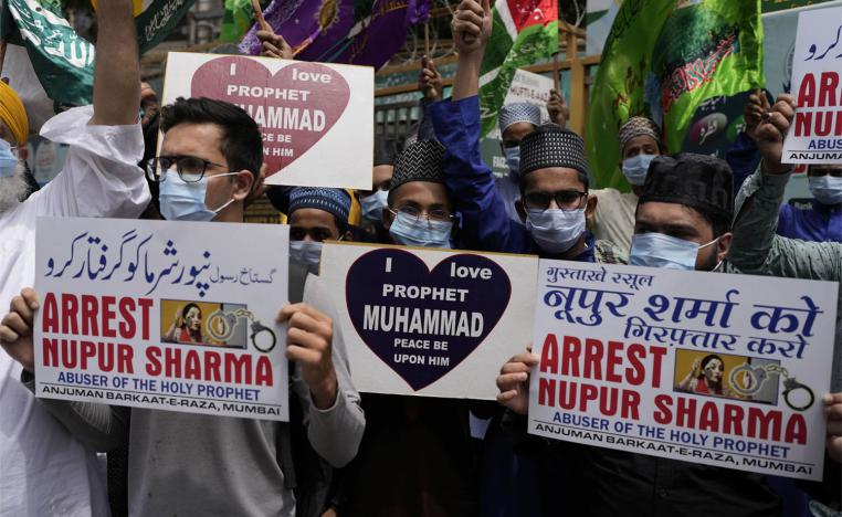 Indian Muslims hold placards demanding the arrest of Nupur Sharma