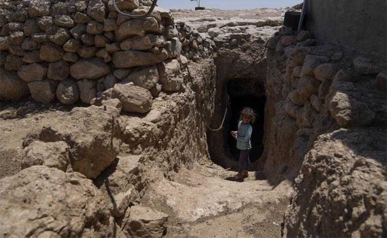 The entrance to Abu Sabaha's cave is surrounded by the ruins of homes and animal pens that the soldiers demolished in earlier raids