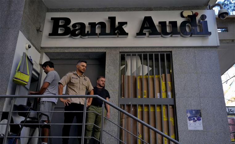 Crowds of anxious Lebanese gathered around ATM machines
