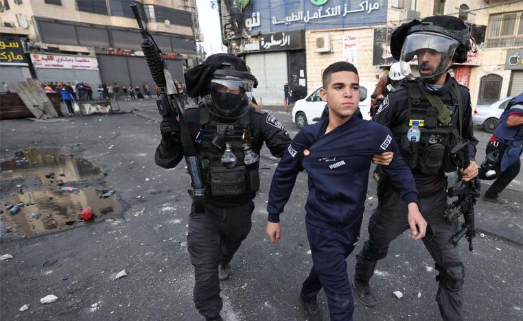 Israeli soldiers in confrontation with Palestinian protesters at the refugee camp
