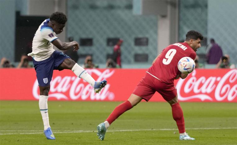 England's Saka scores his side's second goal during the World Cup against iran