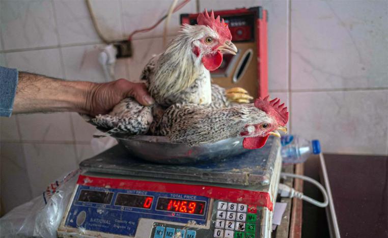 A Shopkeeper says the price of chicken tripled in a year