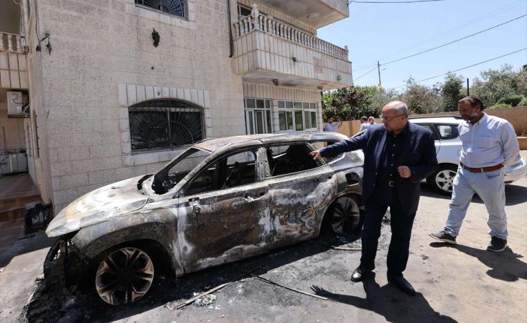 ab-Israeli Knesset member Ahmed Tibi inspects the damage at the site of an attack by Israeli settlers on the village of Turmus Ayya 