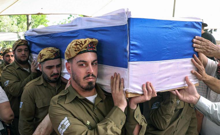 Israeli soldiers carry the coffin of Ohad Dahan, one of three soldiers killed in the cross-border incident with Egypt