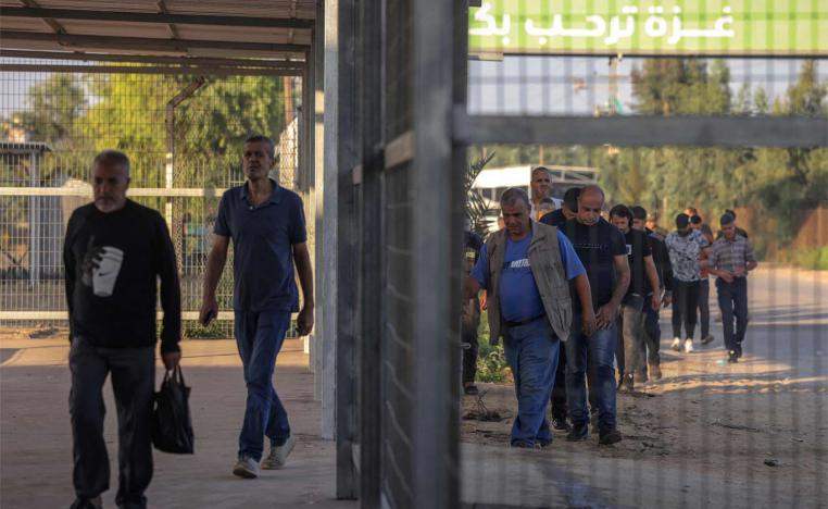 Palestinian workers gather at the Erez crossing between Israel and the northern Gaza Strip