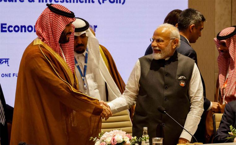 India's Prime Minister Narendra Modi and Saudi Arabia's Crown Prince Mohammed bin Salman shake hands during a session of the G20 Leaders Summit