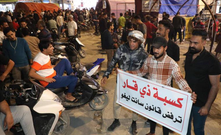 محتجون عراقيون في ذي قار جنوب بغداد على القانون الانتخابي