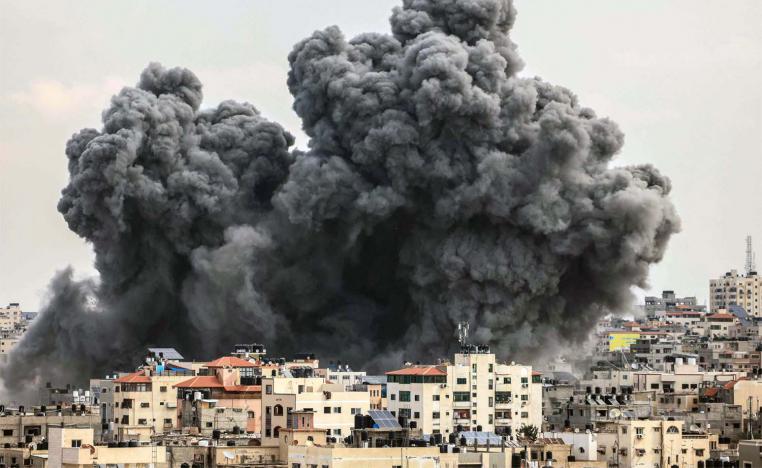 A plume of smoke rises in the sky of Gaza City during an Israeli airstrike