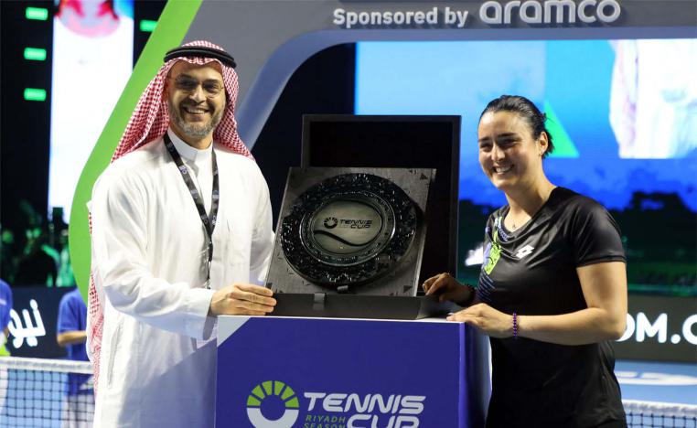 Ons Jabeur receiving a trophy in last month’s exhibition match in Riyadh