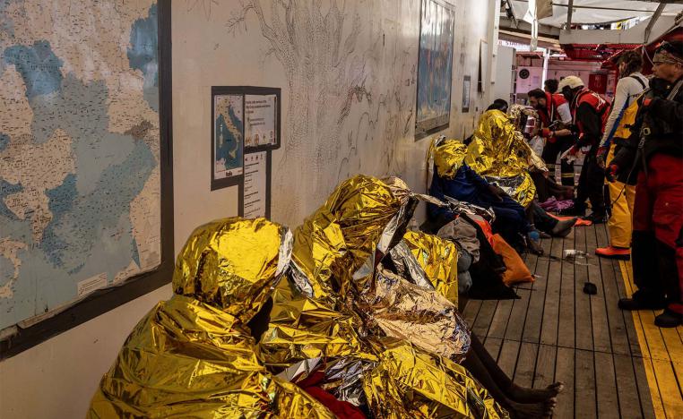 Migrants rest onboard the rescue ship Ocean Viking run by NGO SOS Mediterranee