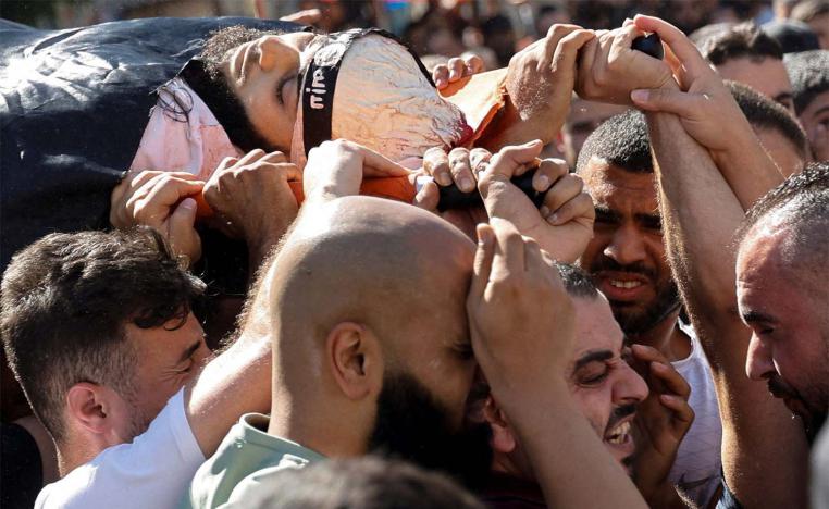 ourners carry the body of Palestinian militant, Nidal al-Amer who was killed by Israeli forces in Jenin