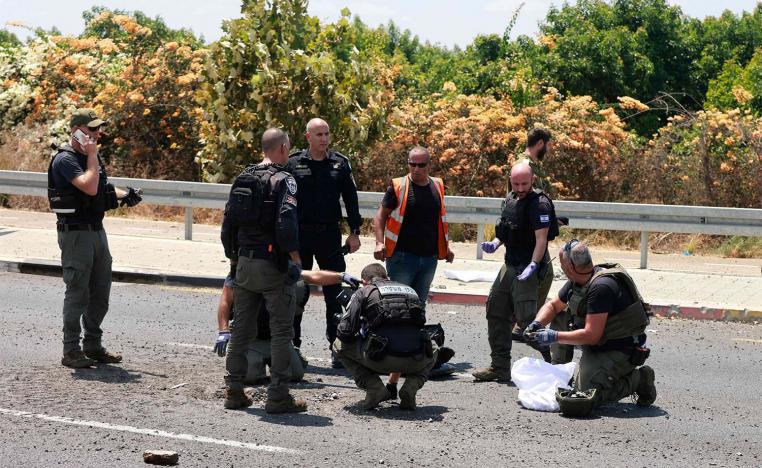 Israeli police check the site of a Hezbollah explosive drone attack near the northern city of Nahariya